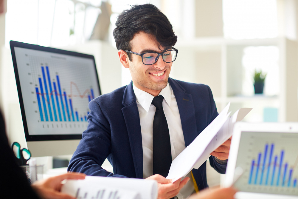 Advisor reviewing financial reports for chiropractic practice planning