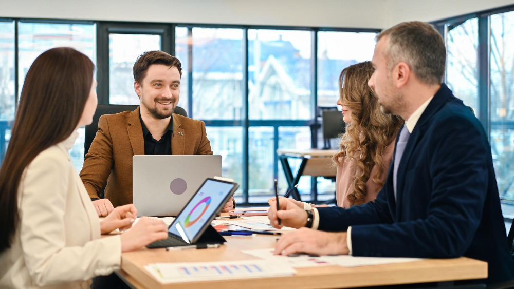 Advisors collaborating over business reports