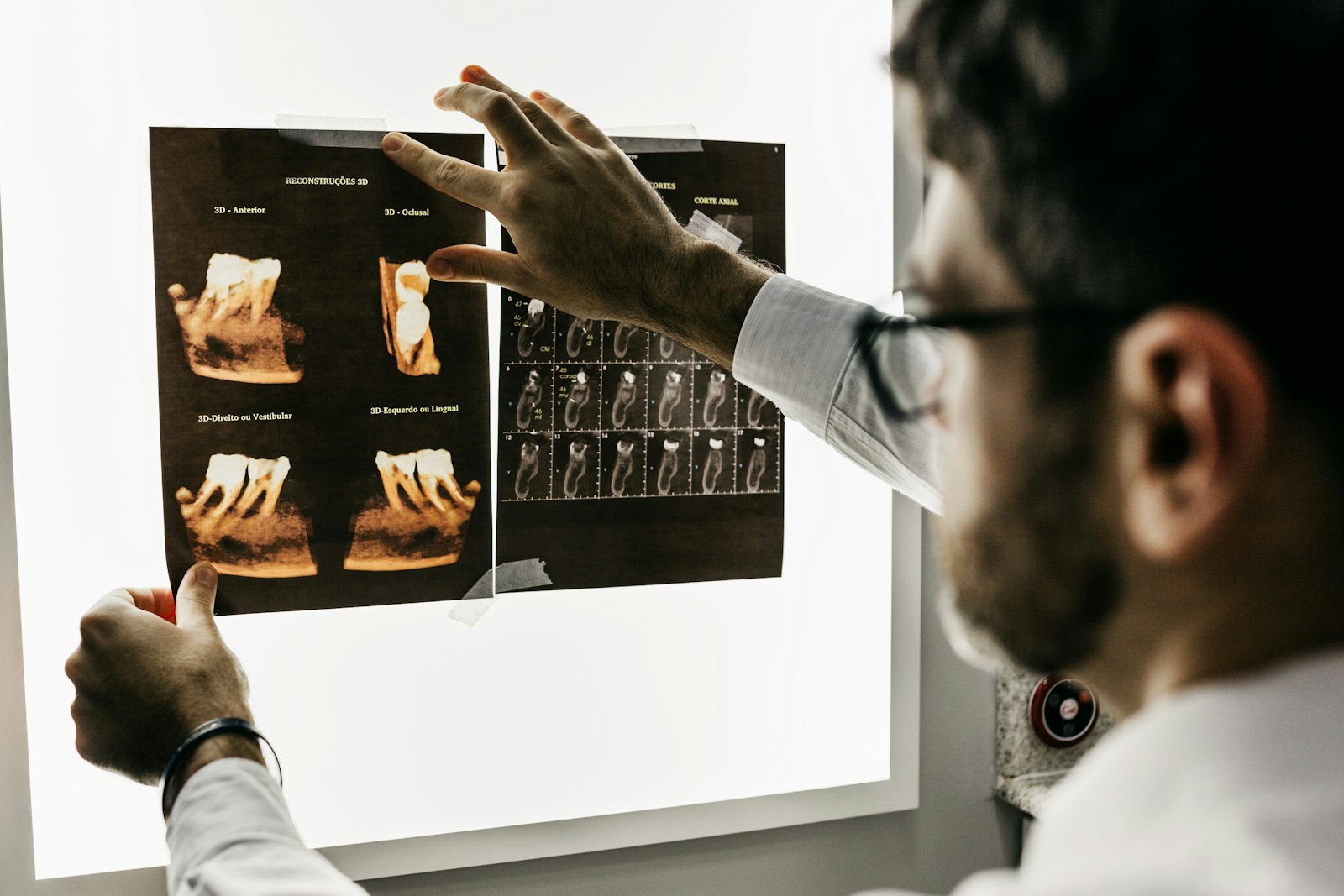 Dental professional reviewing diagnostic images