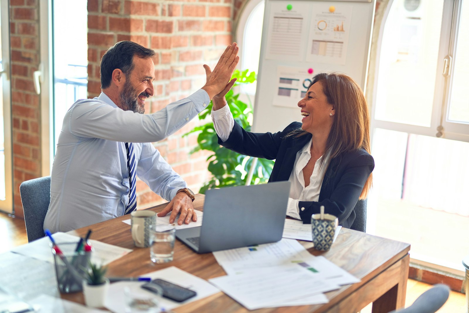 Business partners reviewing performance